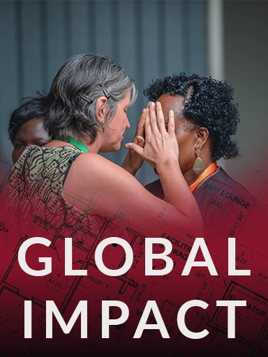 A woman praying for a person with blindness, gently laying her hands on them in faith for healing.
